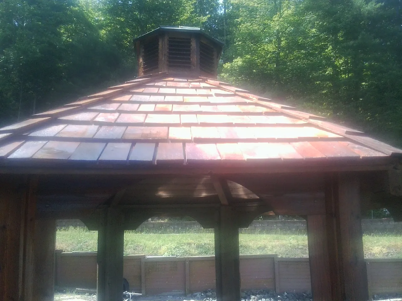 New cedar shake roof and cupola on a lakeside gazebo in Waterbury